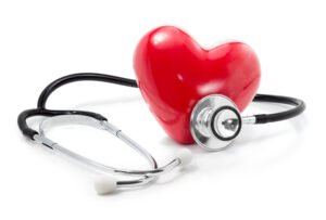 Red heart with stethoscope nearby